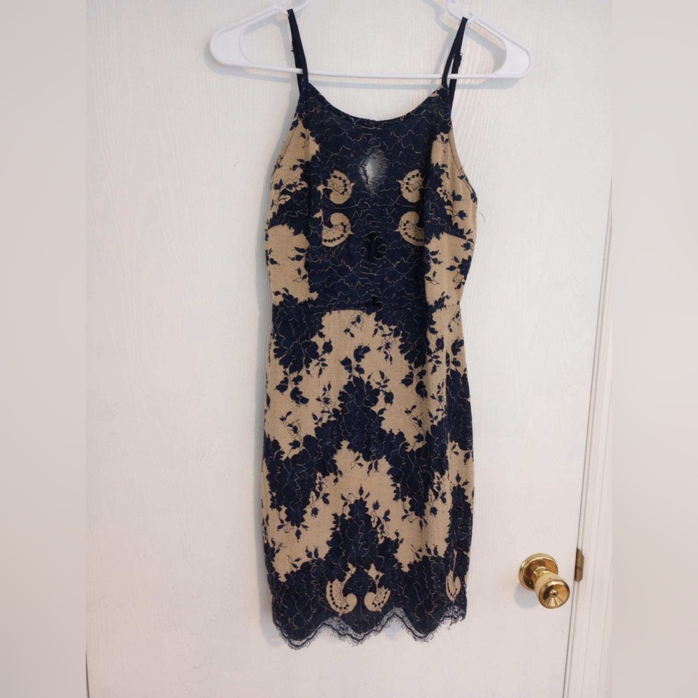 Storia Lace Dress- never worn without tags.  Blue/Cream with 3 cutouts on chest.